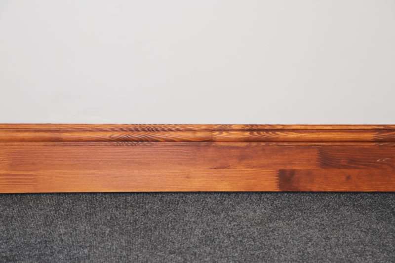 dark stained finer joint pine skirting board
